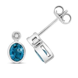 Diamond and Oval Cut Blue Topaz Set Stud Earrings in 9ct White Gold