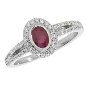 Diamond and Oval Cut Ruby Halo Style Cluster Ring with Split Diamond Set Shoulders in 9ct White Gold