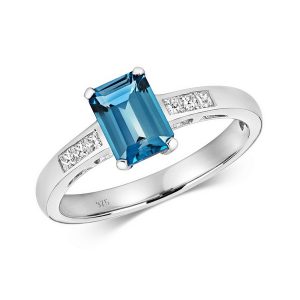 Diamond and Prong Set Emerald Cut London Blue Topaz Dress Ring with Diamond Shoulders in 9ct White Gold