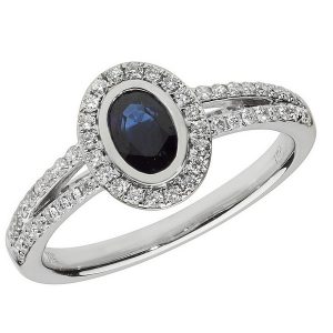 Diamond and Oval Shaped Sapphire Cluster Ring with Split Diamond Shoulders in 18ct White Gold